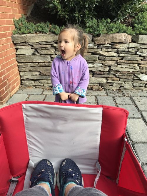 Toddler pulling wagon