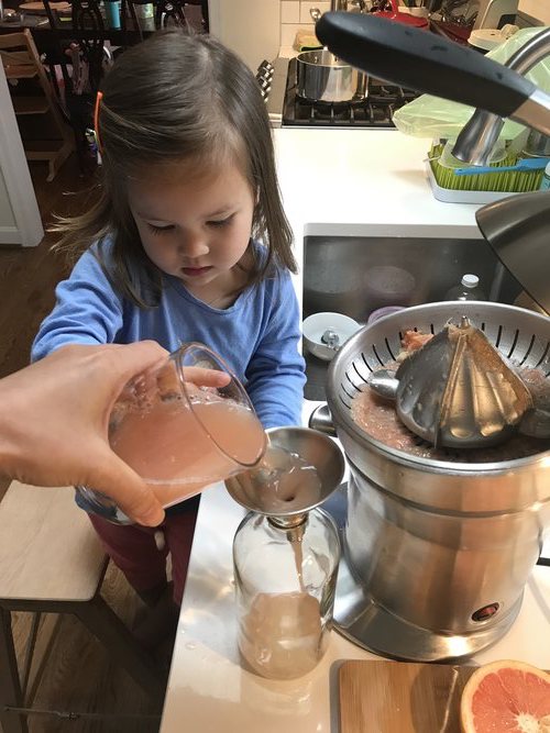 Activities to do at home with toddler Transferring juice to container